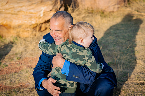 James Boelens hugging child