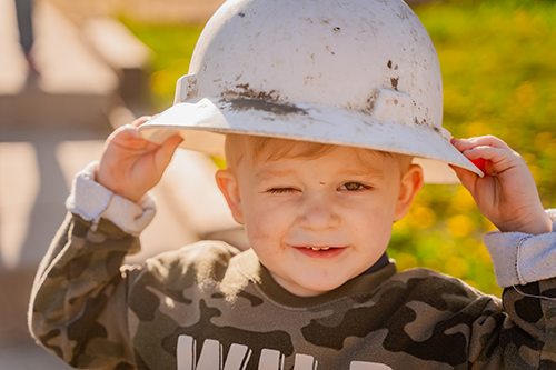 Child wearing hard hat